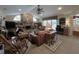 Spacious living room featuring a brick fireplace, vaulted ceilings, and comfortable seating at 6805 Monet Cir, Temple Terrace, FL 33617