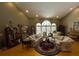 Spacious living room with hardwood floors, large windows providing natural light, and comfortable seating at 6805 Monet Cir, Temple Terrace, FL 33617