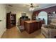 Dedicated office space with a large desk, built-in bookshelves, and a comfortable seating area at 6805 Monet Cir, Temple Terrace, FL 33617