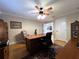 Functional home office with a large wooden desk, ample storage, and comfortable seating, perfect for productivity at 6805 Monet Cir, Temple Terrace, FL 33617