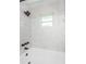 Updated bathroom features a modern shower head and bright window at 6935 Monte Carlo N, Pinellas Park, FL 33781