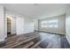 Bright bedroom featuring modern flooring, fresh paint, a closet and a window at 6935 Monte Carlo N, Pinellas Park, FL 33781