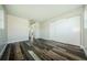 Spacious bedroom featuring wood-look flooring and a closet with sliding doors at 6935 Monte Carlo N, Pinellas Park, FL 33781