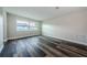 Bedroom featuring modern flooring, fresh paint, and a bright window view at 6935 Monte Carlo N, Pinellas Park, FL 33781