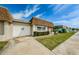 Well-maintained single-story home with a one car garage, manicured landscaping, and a well-maintained lawn at 6935 Monte Carlo N, Pinellas Park, FL 33781