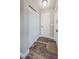 Well-lit hallway featuring modern flooring, a closet, and neutral paint tones at 6935 Monte Carlo N, Pinellas Park, FL 33781