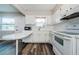 All white kitchen featuring updated countertops, flooring and new stainless steel appliances at 6935 Monte Carlo N, Pinellas Park, FL 33781