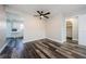 A spacious open-concept living room with wood-look floors and access to the kitchen at 6935 Monte Carlo N, Pinellas Park, FL 33781