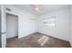This bedroom offers carpet, ceiling fan, closet and ensuite entrance for comfortable living at 7051 Dartmouth N Ave, St Petersburg, FL 33710