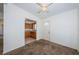 Cozy dining area with ceiling fan, kitchen view and front door access at 7051 Dartmouth N Ave, St Petersburg, FL 33710