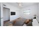 This main bedroom features carpet, ceiling fan, closet, and ensuite entrance for convenience at 7051 Dartmouth N Ave, St Petersburg, FL 33710