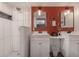 Updated bathroom with double vanity, shower, and a contemporary design at 7311 N Dartmouth Ave, Tampa, FL 33604