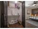 Main bedroom closet features shelving, ceiling fan and an ironing board at 7311 N Dartmouth Ave, Tampa, FL 33604