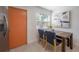 Cozy dining area with natural light, stylish seating, and modern decor adjacent to the kitchen at 7311 N Dartmouth Ave, Tampa, FL 33604