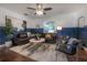 Cozy living space featuring stylish decor, a plush sofa, and a comfortable atmosphere at 7311 N Dartmouth Ave, Tampa, FL 33604