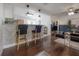 Comfortable living area with sleek bar seating, open floorplan, and modern decor at 7311 N Dartmouth Ave, Tampa, FL 33604