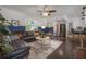 Comfortable living room with a large sectional sofa and an inviting open-concept design at 7311 N Dartmouth Ave, Tampa, FL 33604