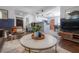 Cozy living room featuring stylish furniture and open floor plan with an eat-in kitchen at 7311 N Dartmouth Ave, Tampa, FL 33604
