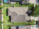 The aerial view showcases the property's backyard, landscaping, privacy fence and roof at 8248 Sequester Loop, Land O Lakes, FL 34637