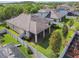 This aerial shot highlights the property's fenced yard and enclosed lanai, situated in a lush, green neighborhood at 8248 Sequester Loop, Land O Lakes, FL 34637