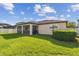 A lush lawn and screened lanai offer a relaxing backyard retreat at 8248 Sequester Loop, Land O Lakes, FL 34637