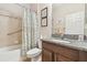 Bathroom with granite countertop and shower-tub combo at 8248 Sequester Loop, Land O Lakes, FL 34637