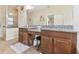 Elegant bathroom with double vanities, granite countertops, and tiled floors at 8248 Sequester Loop, Land O Lakes, FL 34637
