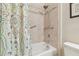 Clean bathroom featuring a shower and a colorful shower curtain at 8248 Sequester Loop, Land O Lakes, FL 34637