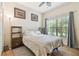 Cozy bedroom featuring a ceiling fan and natural light at 8248 Sequester Loop, Land O Lakes, FL 34637