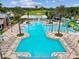 A resort-style community pool with lounge chairs and a splash pad for children at 8248 Sequester Loop, Land O Lakes, FL 34637
