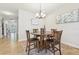 Inviting dining area with tile floors and a modern chandelier fixture at 8248 Sequester Loop, Land O Lakes, FL 34637