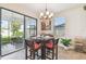 Dining area with sliding glass doors offering backyard view and natural light at 8248 Sequester Loop, Land O Lakes, FL 34637