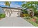 Charming home with a two-car garage and well-manicured landscaping at 8248 Sequester Loop, Land O Lakes, FL 34637