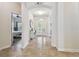 Welcoming foyer with tiled flooring, arched doorways, and a view of the front door at 8248 Sequester Loop, Land O Lakes, FL 34637