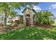Inviting front yard with lush landscaping and a covered entryway at 8248 Sequester Loop, Land O Lakes, FL 34637