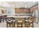 Kitchen with granite countertop, a tile backsplash, and stainless appliances at 8248 Sequester Loop, Land O Lakes, FL 34637
