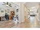 Spacious home office with french doors, a ceiling fan, and wood-look flooring at 8248 Sequester Loop, Land O Lakes, FL 34637