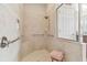 Accessible walk-in shower with beige tile surround and safety bars at 8248 Sequester Loop, Land O Lakes, FL 34637