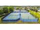An aerial view of the community sports courts, featuring tennis and basketball courts for residents to enjoy at 8248 Sequester Loop, Land O Lakes, FL 34637