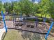 Swings at the neighborhood park with a gazebo at 8248 Sequester Loop, Land O Lakes, FL 34637