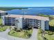Scenic aerial of condo building featuring lush landscaping and stunning waterfront views at 8251 Brent St # 941, Port Richey, FL 34668