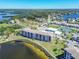 Beautiful aerial view of a waterfront condominium with community pool and tennis courts at 8251 Brent St # 941, Port Richey, FL 34668