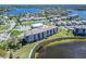 Scenic aerial shot of condos near the water, with a tennis court and community pool at 8251 Brent St # 941, Port Richey, FL 34668