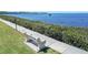 Scenic view of bay from sidewalk with bench at 8251 Brent St # 941, Port Richey, FL 34668