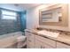 Bright bathroom with vanity, granite counters, a shower and a bath at 8251 Brent St # 941, Port Richey, FL 34668