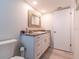 Bright bathroom featuring vanity and granite counters at 8251 Brent St # 941, Port Richey, FL 34668