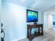 Inviting foyer featuring a decorative table, art, and wood-look floors, creating an elegant entrance at 8251 Brent St # 941, Port Richey, FL 34668