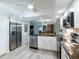 Contemporary kitchen featuring stainless appliances, granite countertops, and ample cabinet space at 8251 Brent St # 941, Port Richey, FL 34668