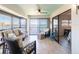 Well-furnished lanai showcasing picturesque waterfront views, a ceiling fan, and comfortable seating at 8251 Brent St # 941, Port Richey, FL 34668