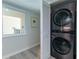 Laundry Room featuring a stacked Washer and Dryer at 8251 Brent St # 941, Port Richey, FL 34668